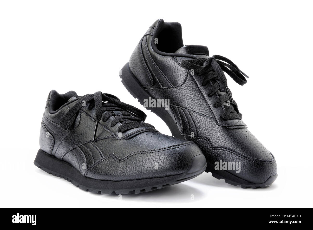 Closeup of a pair of black sport shoes for women, isolated on white