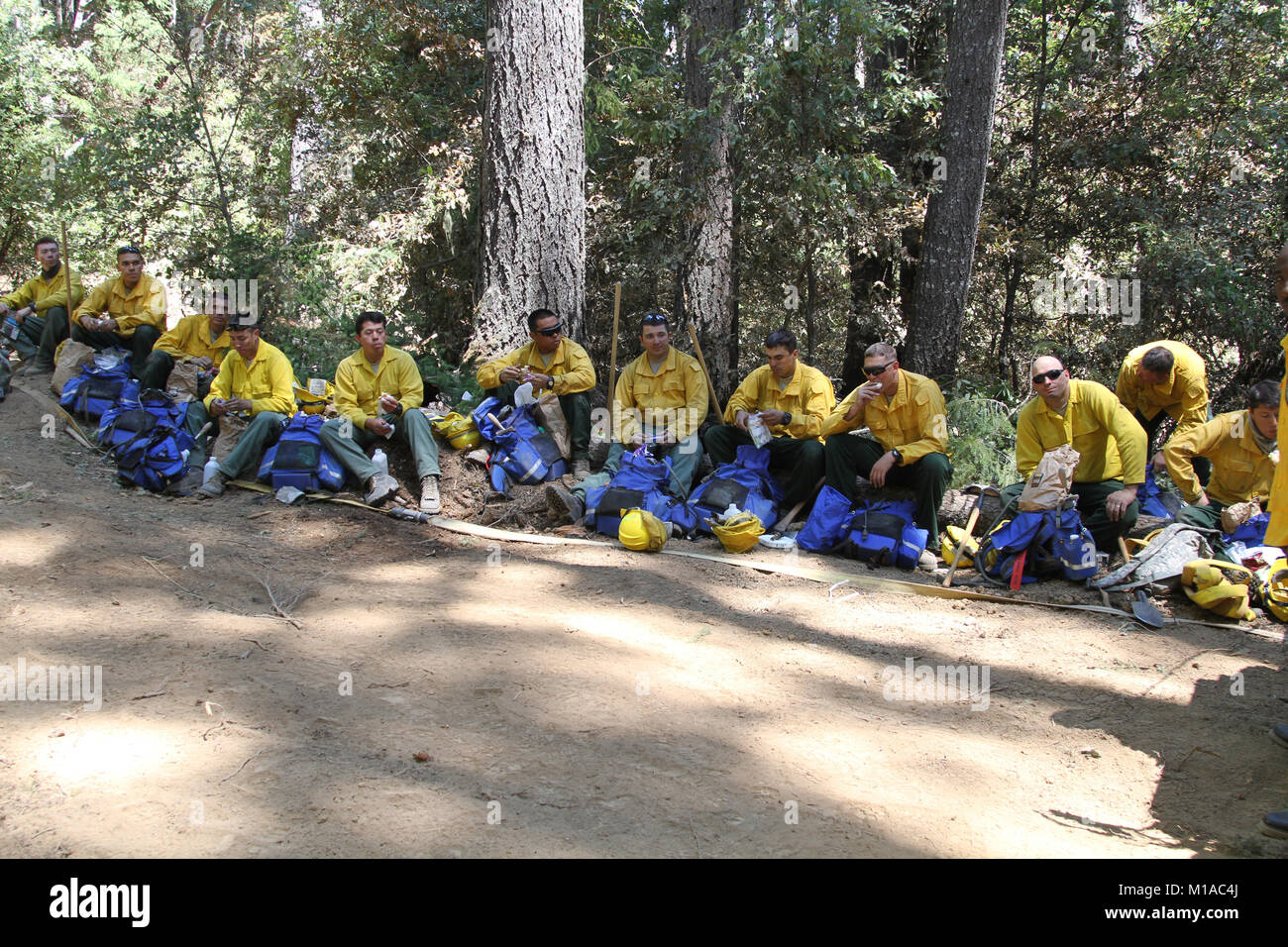 Crew members from Task Force Alpha, California Army National Guard, rest Aug. 9 after mopping up a burnt area near the mountains of Wildcat Butte, Humboldt County, California. (U.S. Army National Guard photo/Staff Sgt. Eddie Siguenza) Stock Photo
