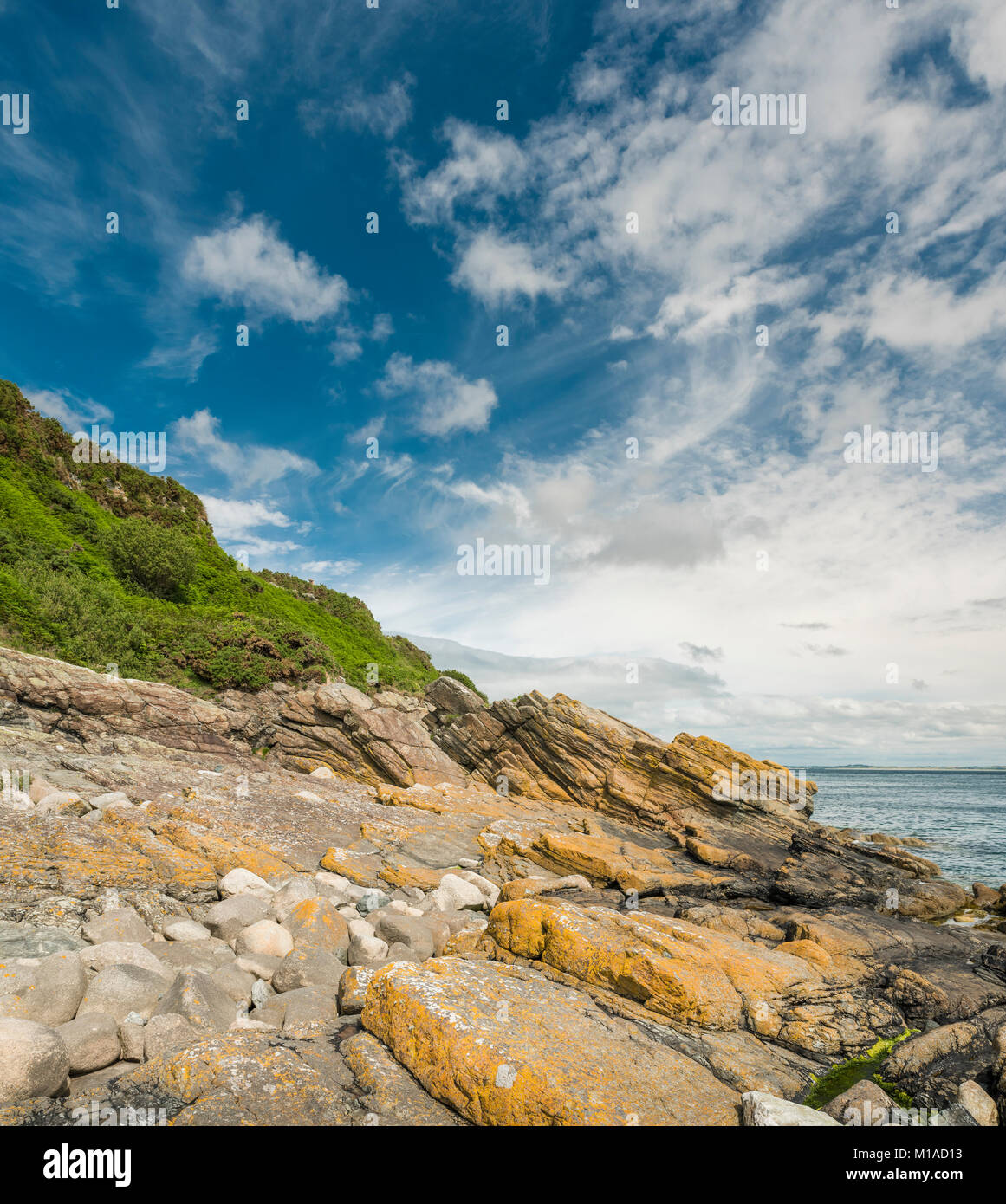 Foreshore exposures at Bloody Bridge, named after a massacre in 1641, on the coast of south County Down west of Newcastle, Northern Ireland Stock Photo