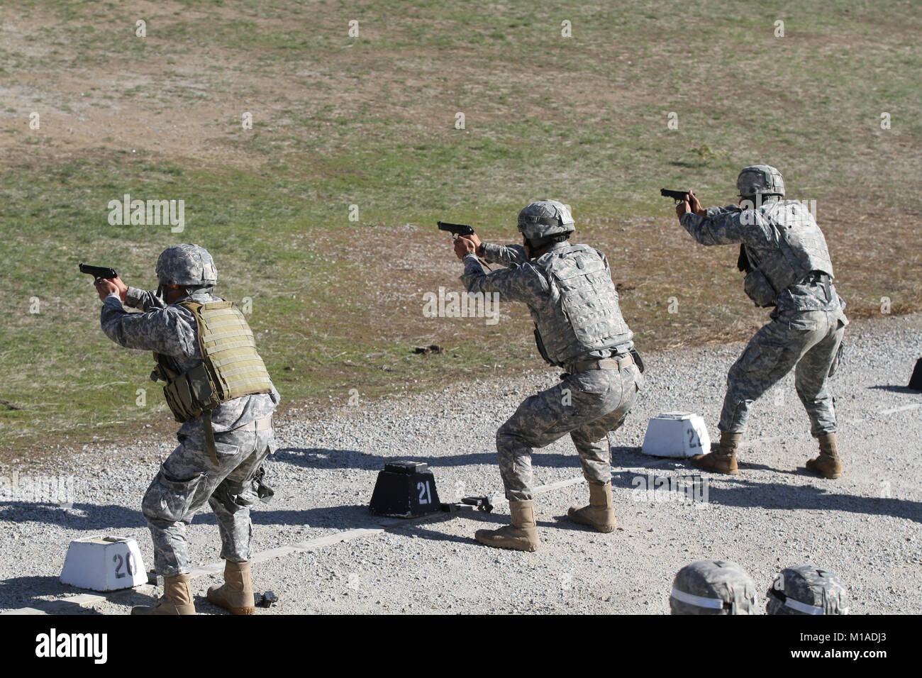 Competitors in the California Army National Guard’s 2015 Best Warrior Competition fire 9-millimeter hand weapons for qualification Nov. 18 at Camp San Luis Obispo, San Luis Obispo, California. (U.S. Army National Guard photo/Staff Sgt. Eddie Siguenza) Stock Photo