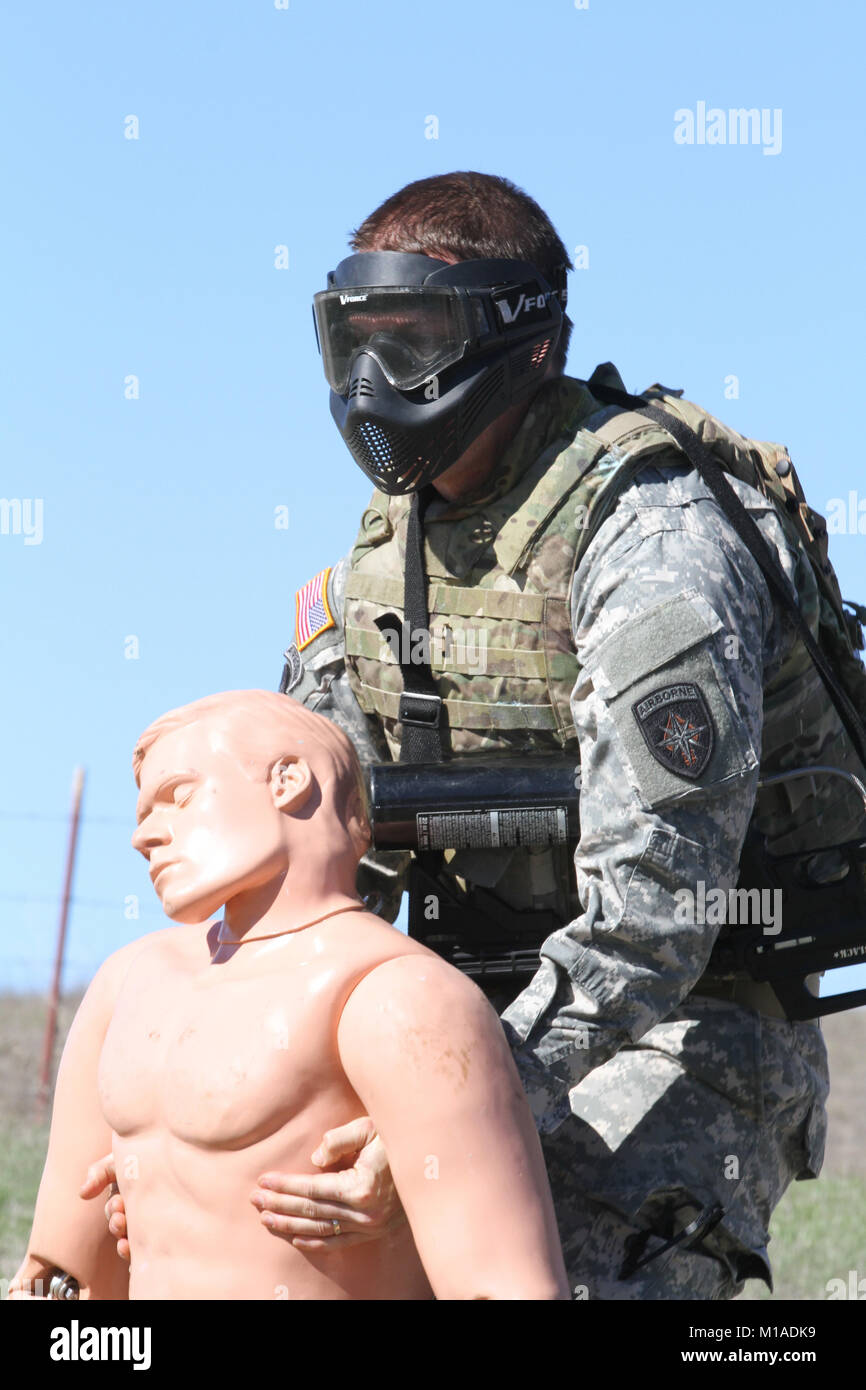 Sgt. 1st Class Erik Hart, Special Operations Detachment - North, drags a mannequin simulating an injured Soldier to a safe zone during the Nov. 19 Urban Operations portion of the California Army National Guard’s 2015 Best Warrior Competition at Camp San Luis Obispo, San Luis Obispo, California. (U.S. Army National Guard photo/Staff Sgt. Eddie Siguenza) Stock Photo