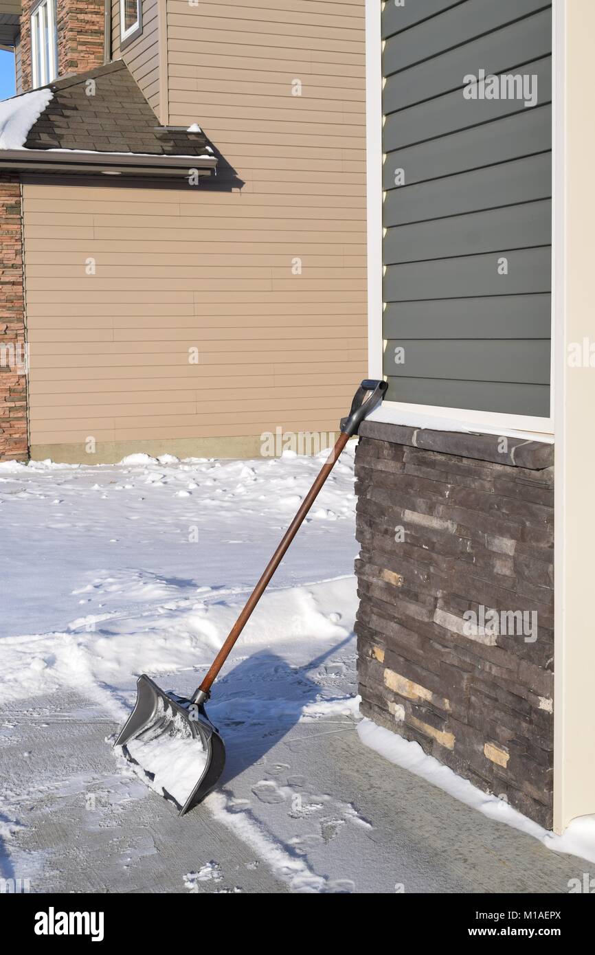 Shovel on the driveway Stock Photo Alamy