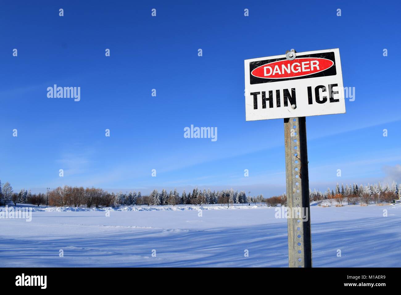Thin ice sign at park Stock Photo