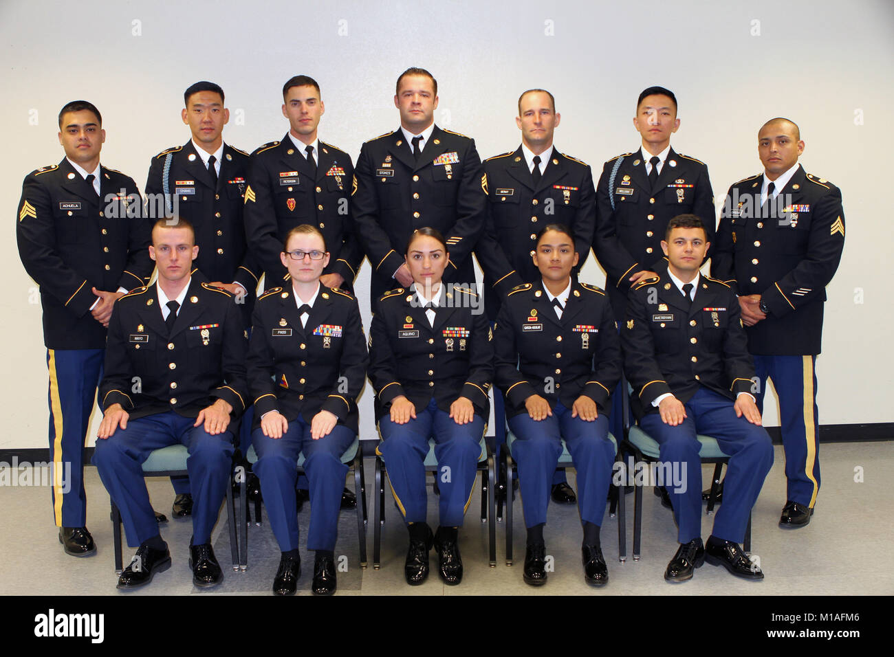 Twelve contestants vied for the Best of the Best honor Nov. 1-5, 2016, in the California Army National Guard’s 2017 Best Warrior Competition at Camp San Luis Obispo, San Luis Obispo, California.Sitting: Spc. Patrick Mayo, 118th Maintenance Company, 224th Sustainment Brigade; Spc. Aurora Pass; 49th Personnel Support Company, 115th Regional Support Group; Sgt. Natalie Aquino, 870th Military Police Company, 49th Military Police Brigade; Spc. Jazmin Garcia-Aguilar, 870th Military Police Company, 49th Military Police Brigade; and Spc. Fabio Avetisyan, Headquarters-Headquarters Detachment, 1106th Th Stock Photo