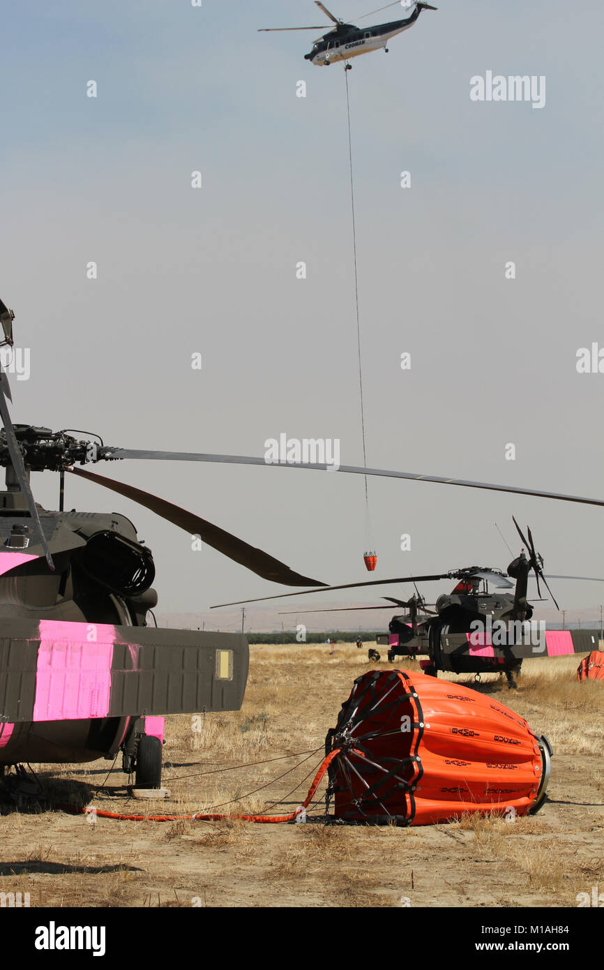 A civiliancontracted helicopter departs the Coalinga Municipal Airport