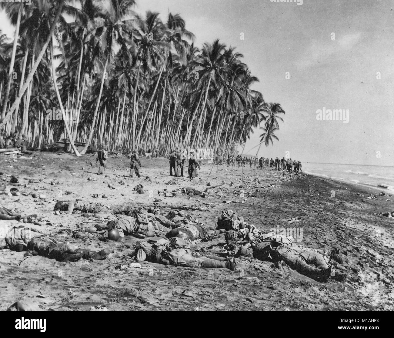 Dead Japanese soldiers lie on the sandbar at the mouth of Alligator Creek on Guadalcanal on 21 August 1942 after being killed by U.S. Marines during the Battle of the Tenaru. August 21, 1942 Stock Photo