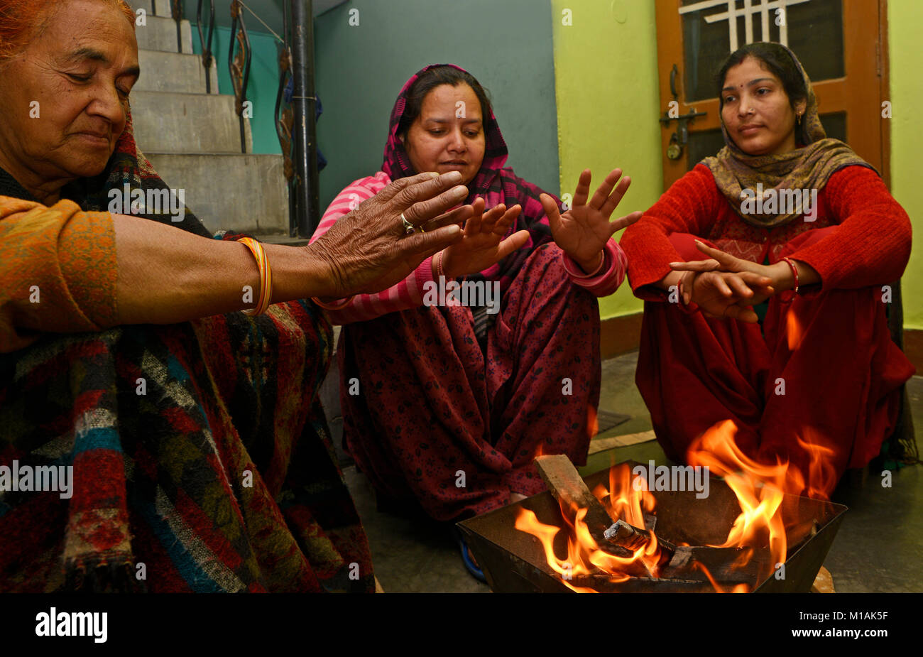 Indian Women trying to keep themselves warm Stock Photo - Alamy