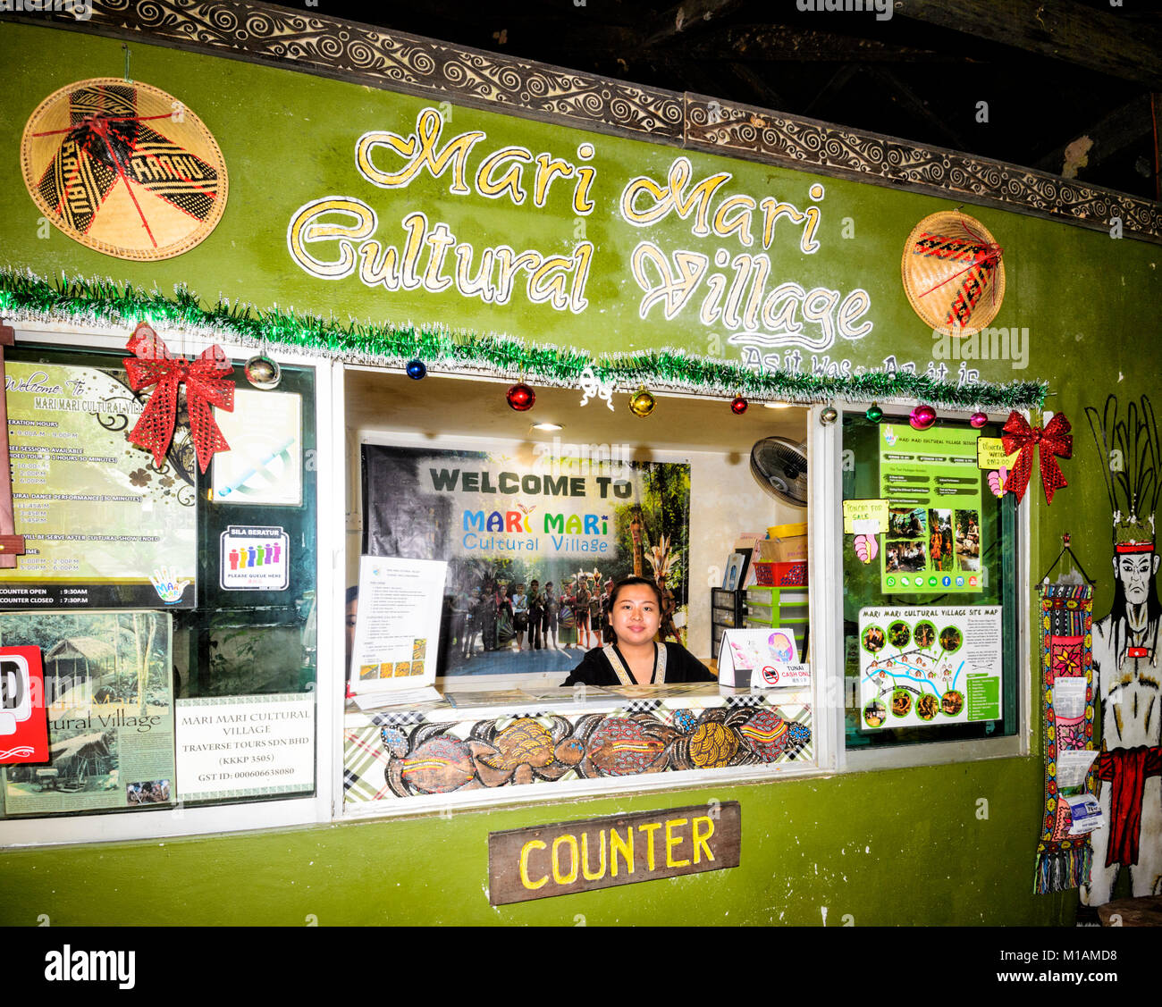 Smiling woman at the counter of Mari Mari Cultural Village, Kota Kinabalu, Sabah, Borneo, Malaysia Stock Photo