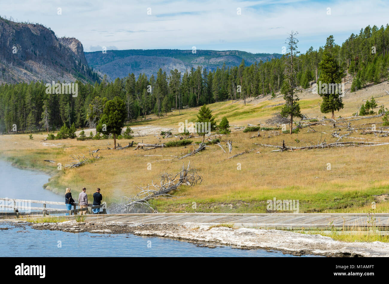 Tourists visiting the Terrace Springs thermal feature.  Yellowstone National Park, Wyoming Stock Photo