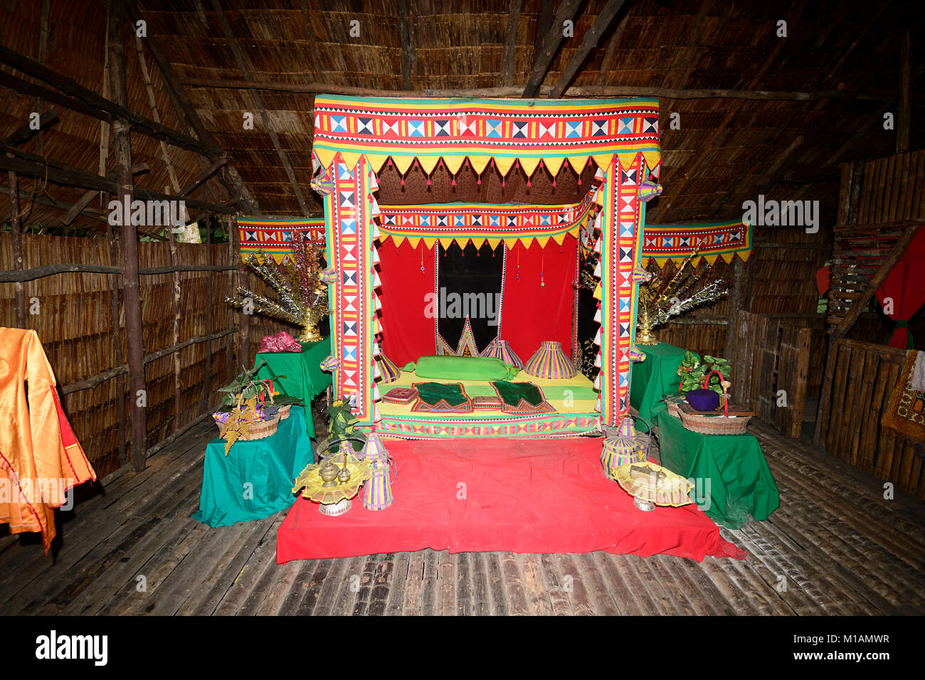 Ornate bed in a traditional longhouse, Mari Mari Cultural Village, Kota Kinabalu, Sabah, Borneo, Malaysia Stock Photo
