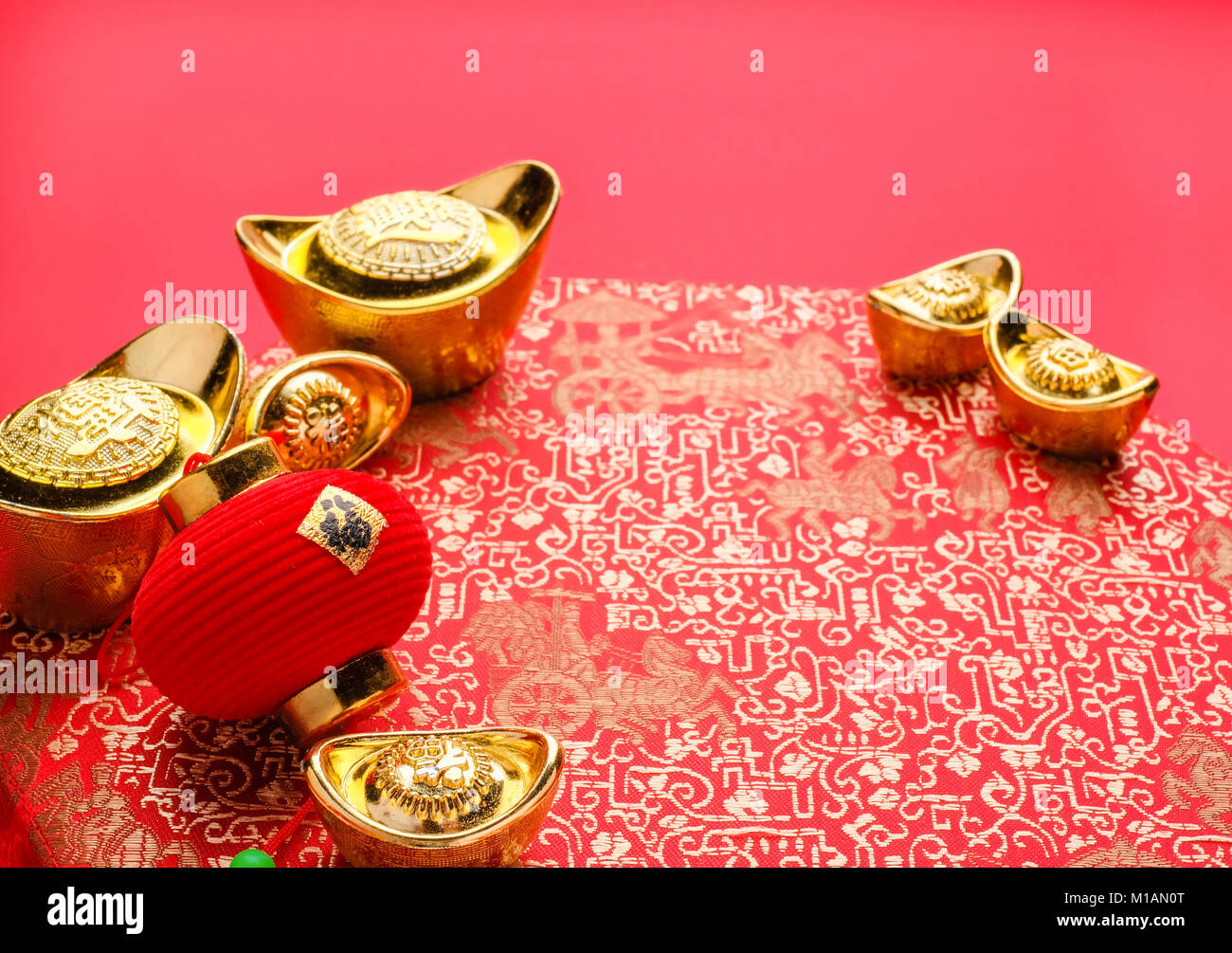 Chinese new year decoration,close up golden ingots ( ang pow )and lamp