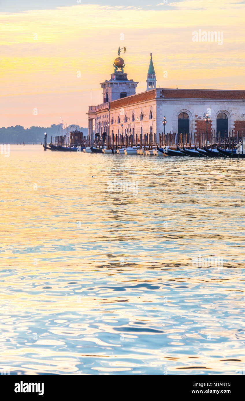 Punta della Dogane of Dogana da Mar, former Customs House in Venice, Italy on a glorious sunrise Stock Photo