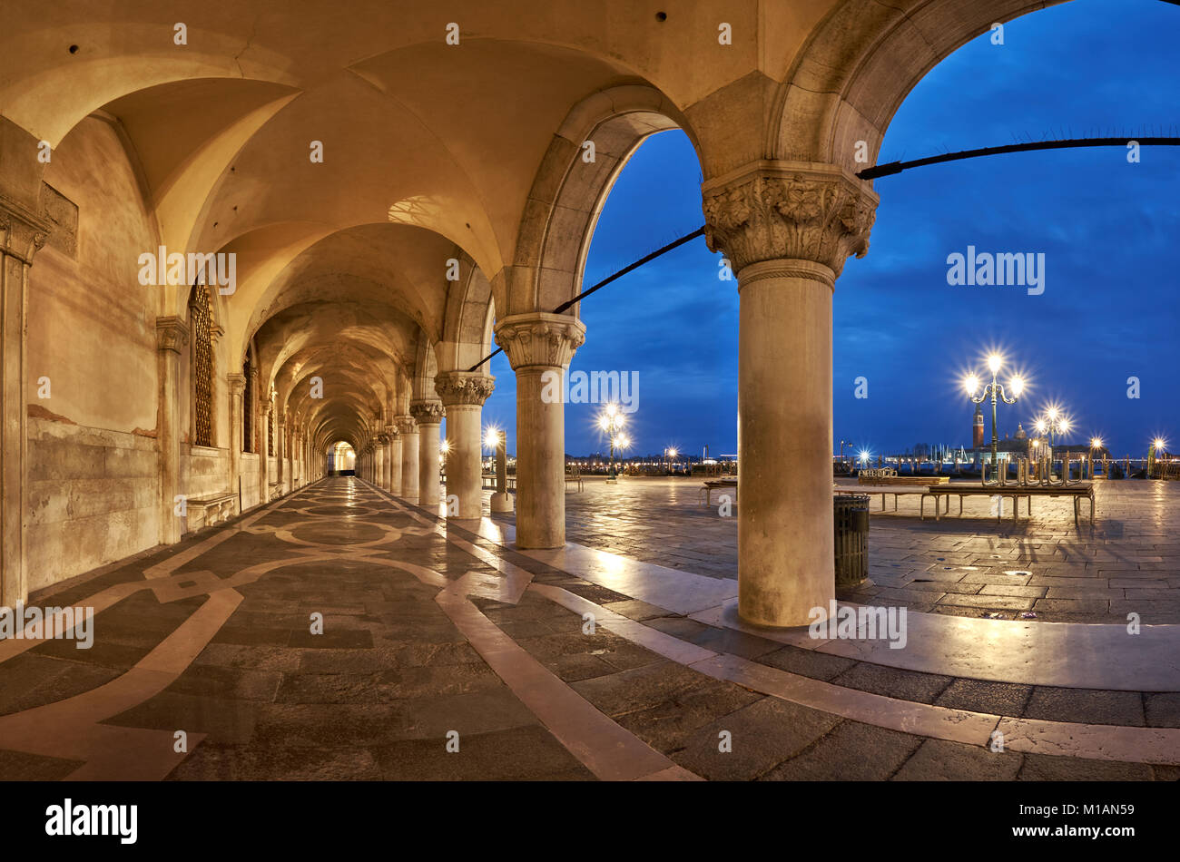 Ancient arches of Doge's Palace St. Marc Square in Venice, Italy. This panoramic image has been taken early in the morning. Stock Photo