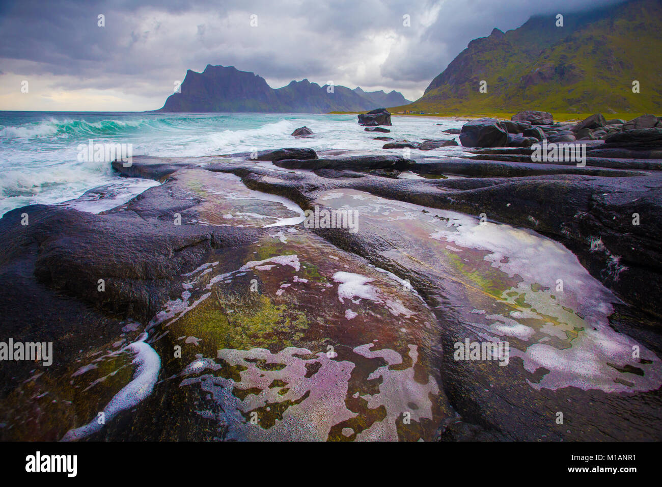 Northern seascape with stone foreground. Landscape of Lofoten islands, Norway. Stock Photo