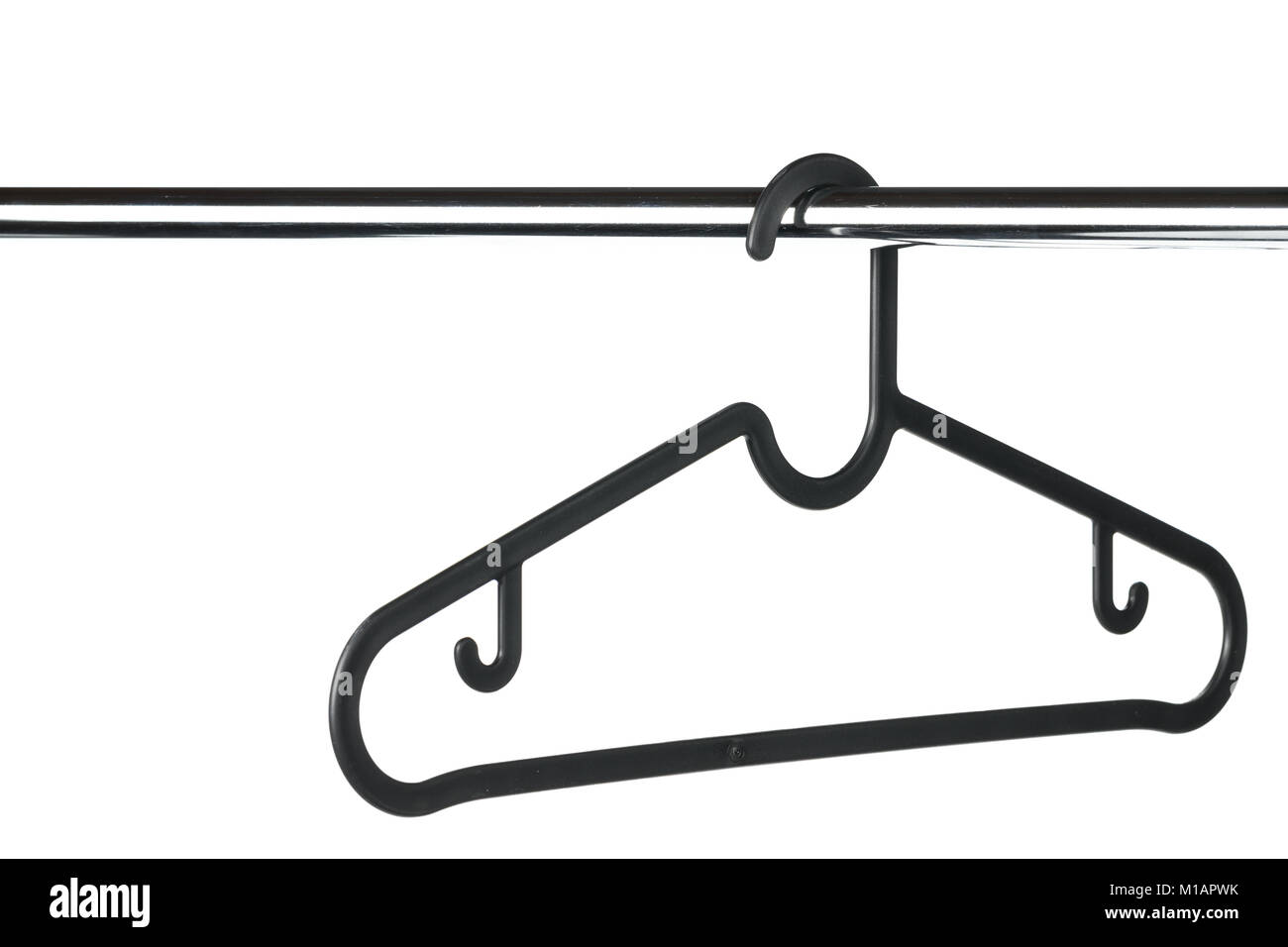 Empty black coat hanger / clothes hanger on a clothes rail with a white background. Potential copy space above and to the left of hanger. Stock Photo