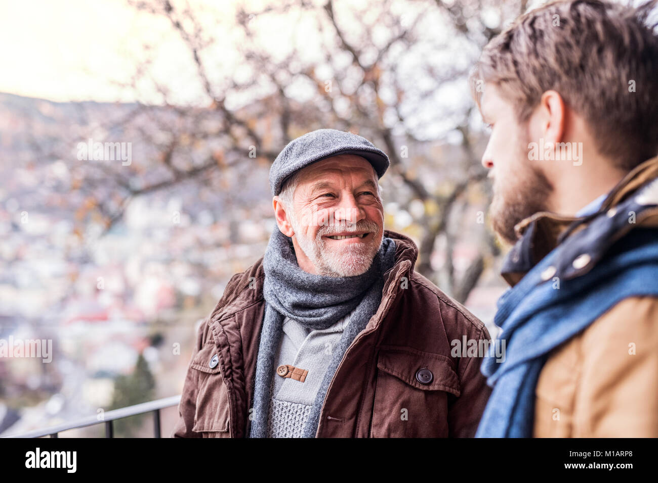 Senior father and his young son on a walk Stock Photo - Alamy