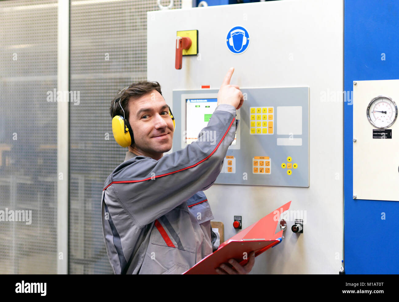 industrial safety workers in an industrial plant with ear protection