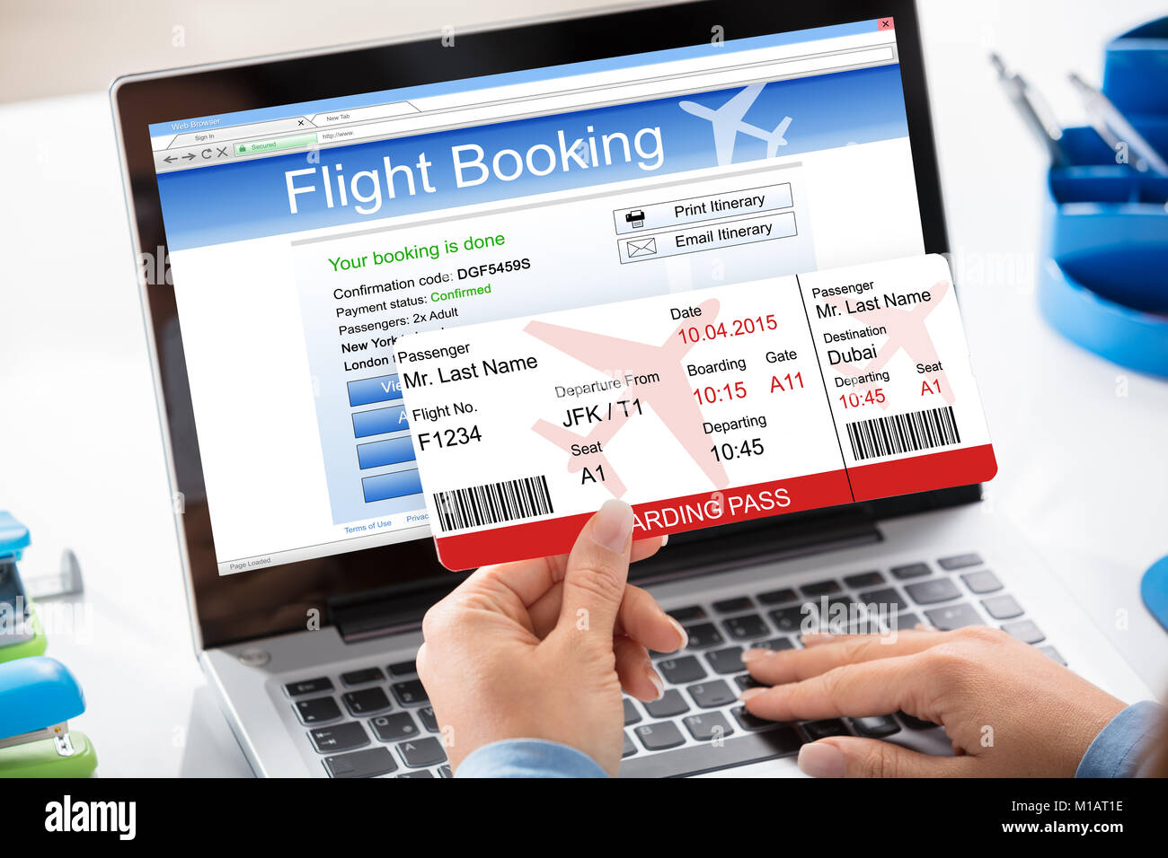 A Woman Booking Flight Online Using Laptop Stock Photo