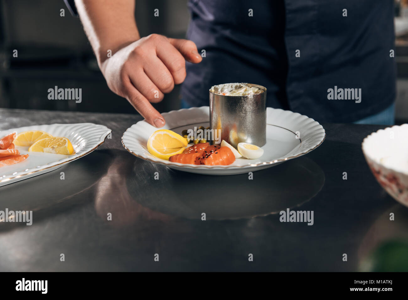 cropped shot of chef preparing salad at restaurant Stock Photo