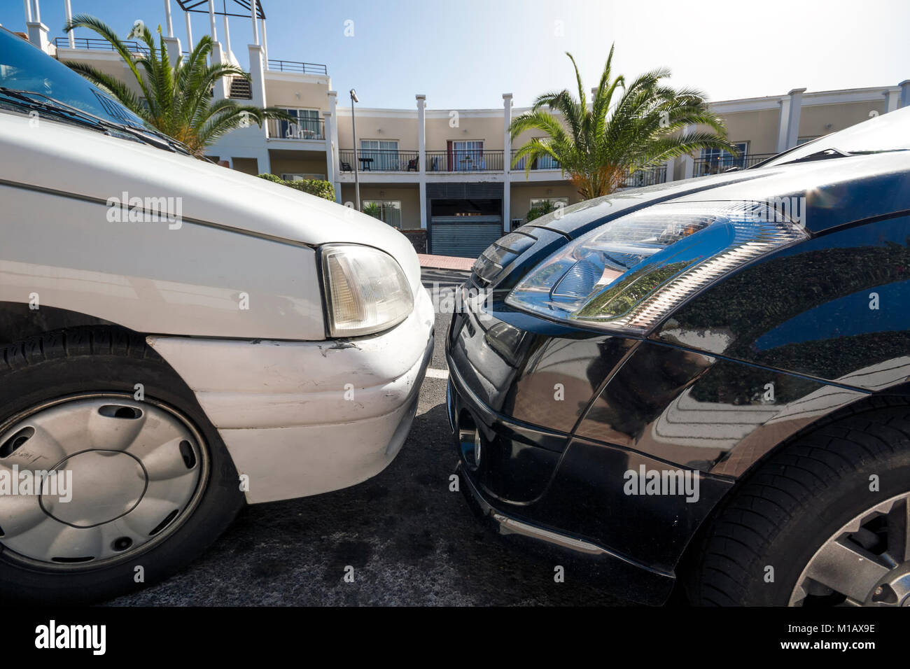 two closely bumper to bumper parking cars Stock Photo Alamy