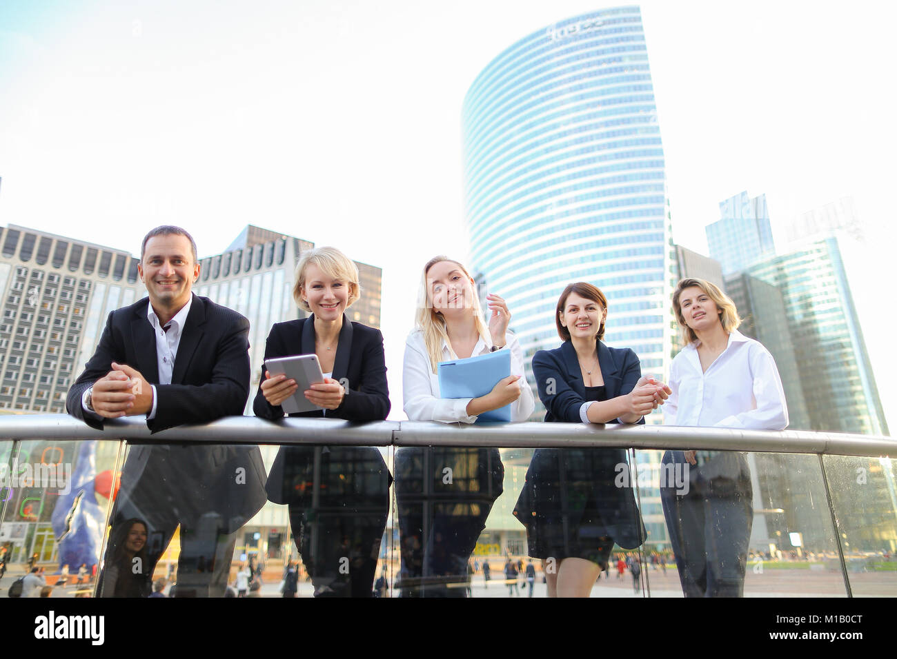 Gallery Detail: Happy Business Team Members Talking Outside In Stock Photo