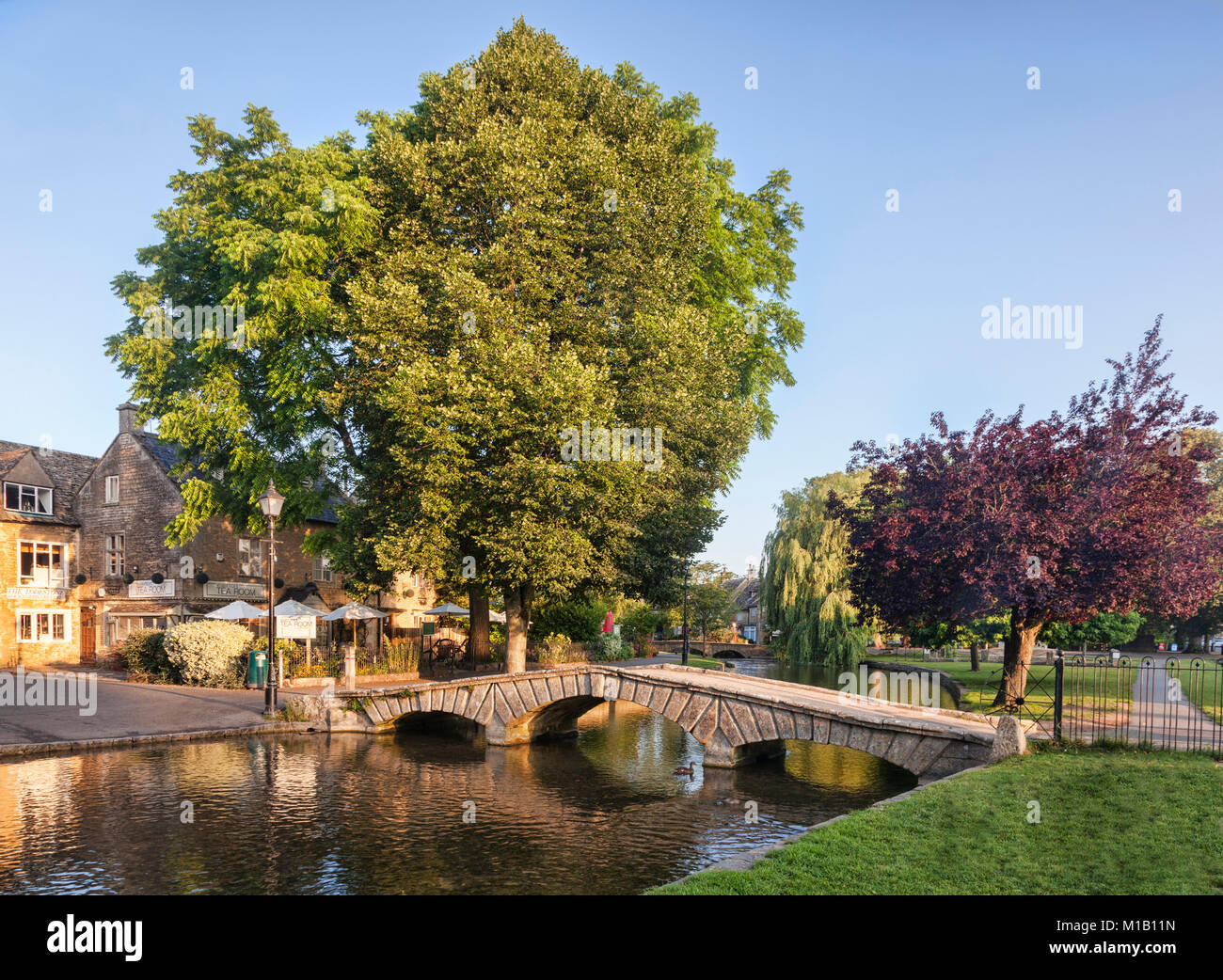 The famous bridge over the River Windrush in the Cotswolds village of Bourton-on-the-Water, Gloucestershire, England Stock Photo