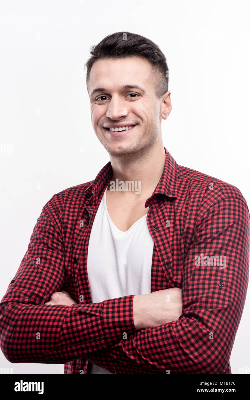Well-built young man folding his arms across his chest Stock Photo