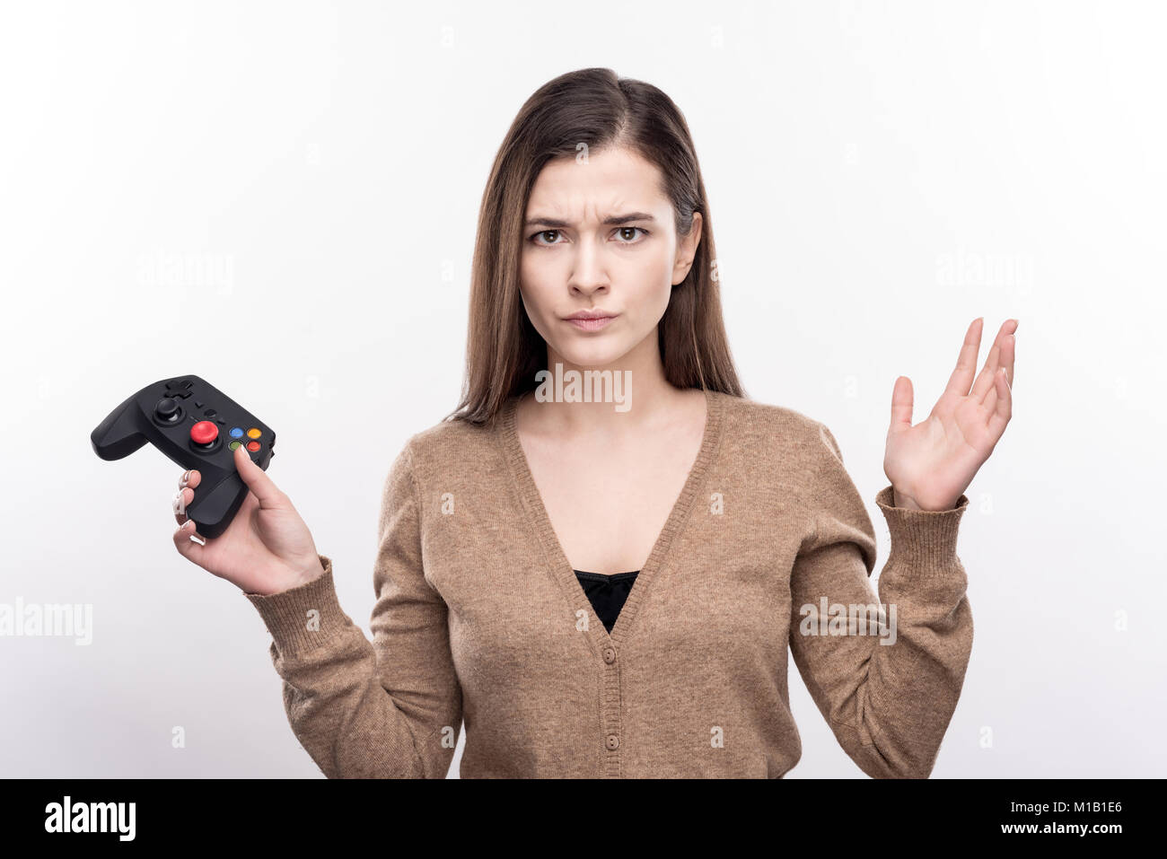 Young woman being angry about her loss in game Stock Photo