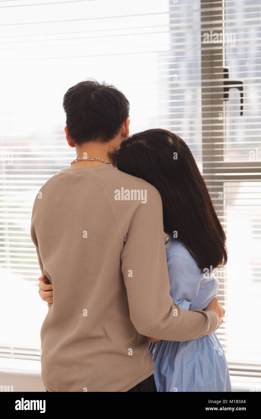 Couple in love. Woman hugging her husband Stock Photo - Alamy