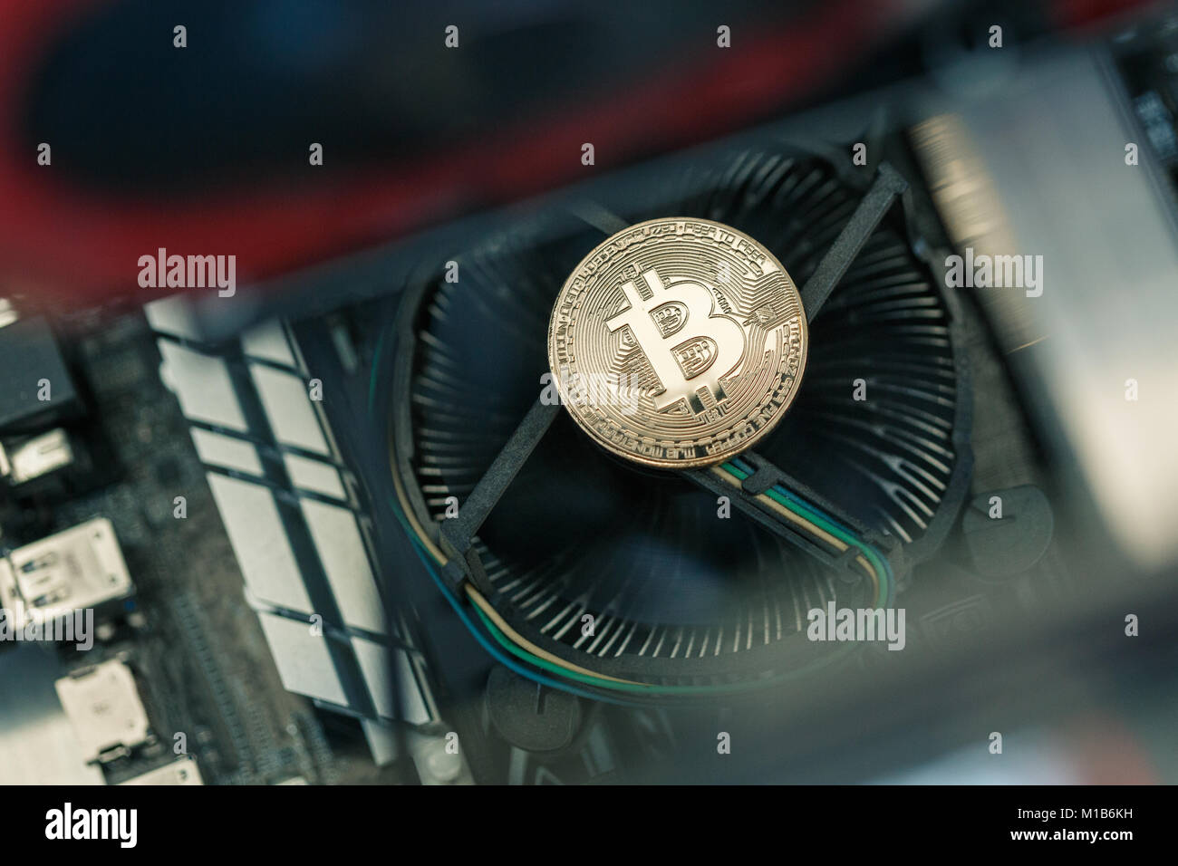 Golden metal coin as symbolic version of Bitcoin on a background of ...