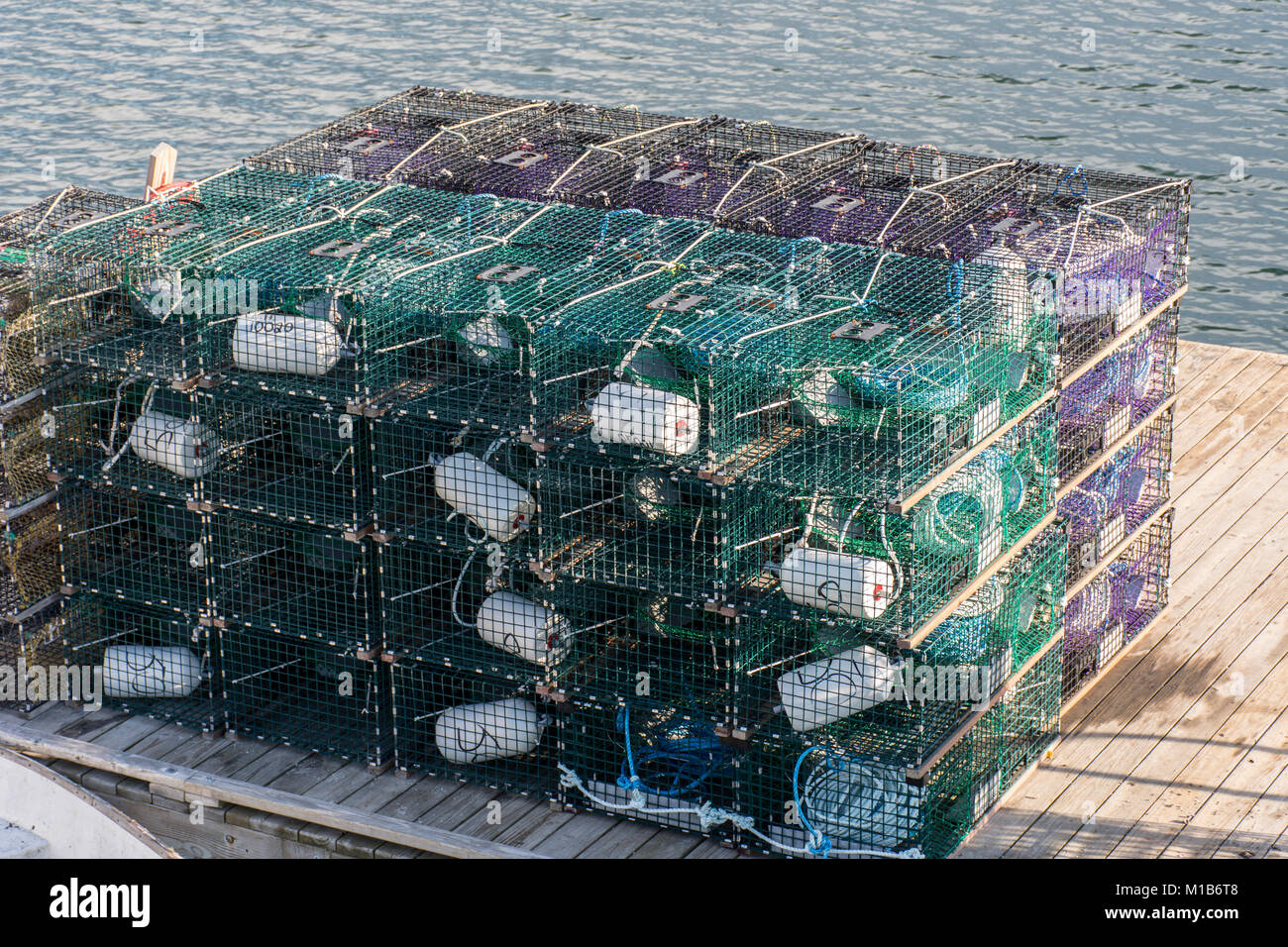 Multiple empty Lobster traps sitting on a dock Stock Photo Alamy
