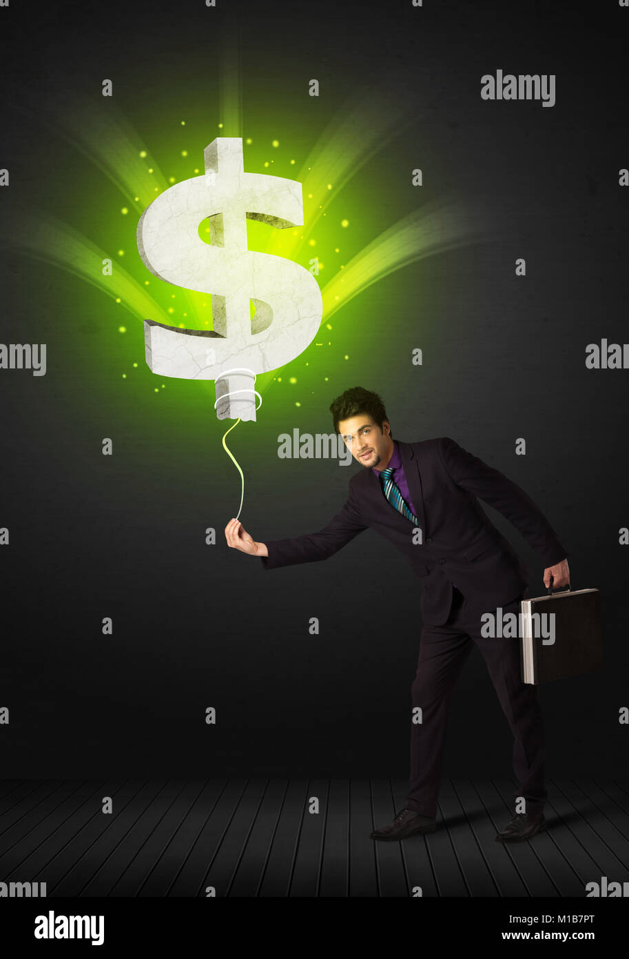 Businessman holding a shining, green dollar sign balloon Stock Photo ...