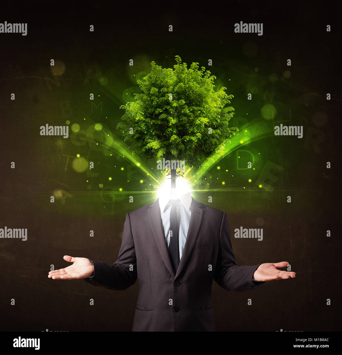 Man with green tree head concept on brown background Stock Photo