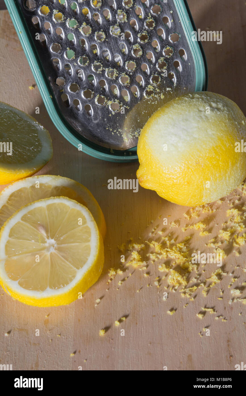 Grating a lemon Stock Photo Alamy