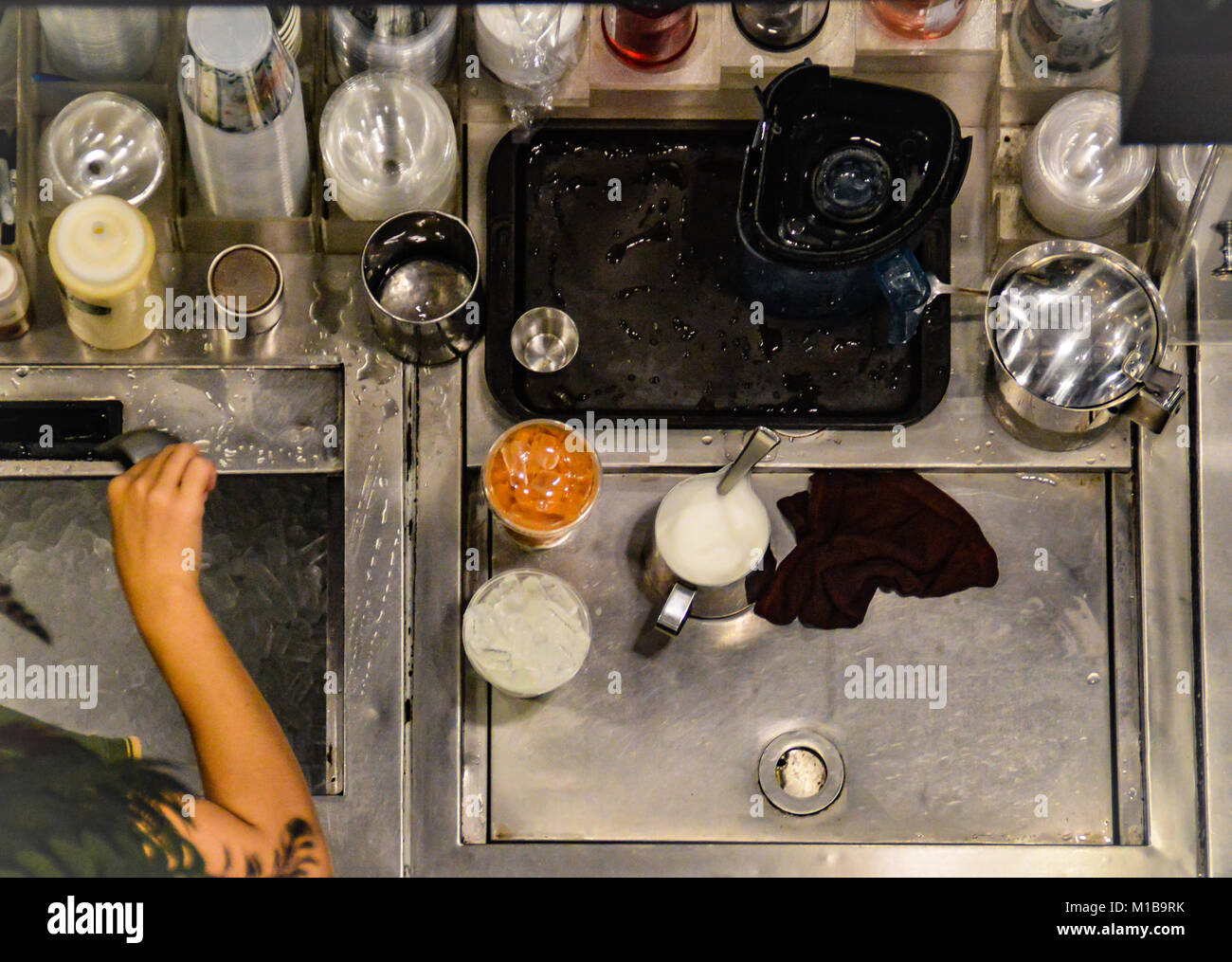 People at work behind the scene in a coffee shop kitchen Stock Photo