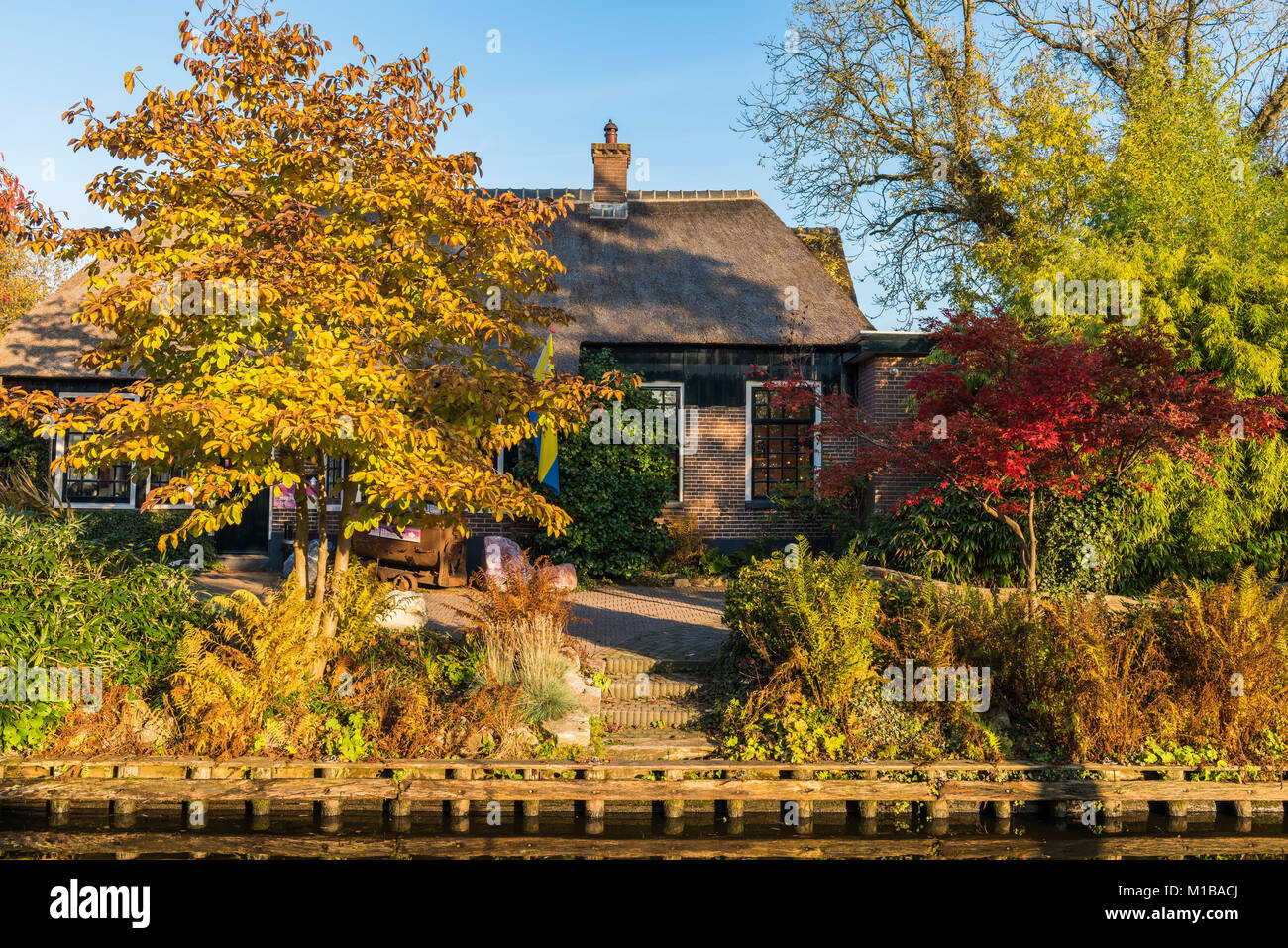 Giethoorn, The Netherlands - October 31, 2016:  Picturesque house in autumn in the small village of Giethoorn in Overijssel, Netherlands. Stock Photo
