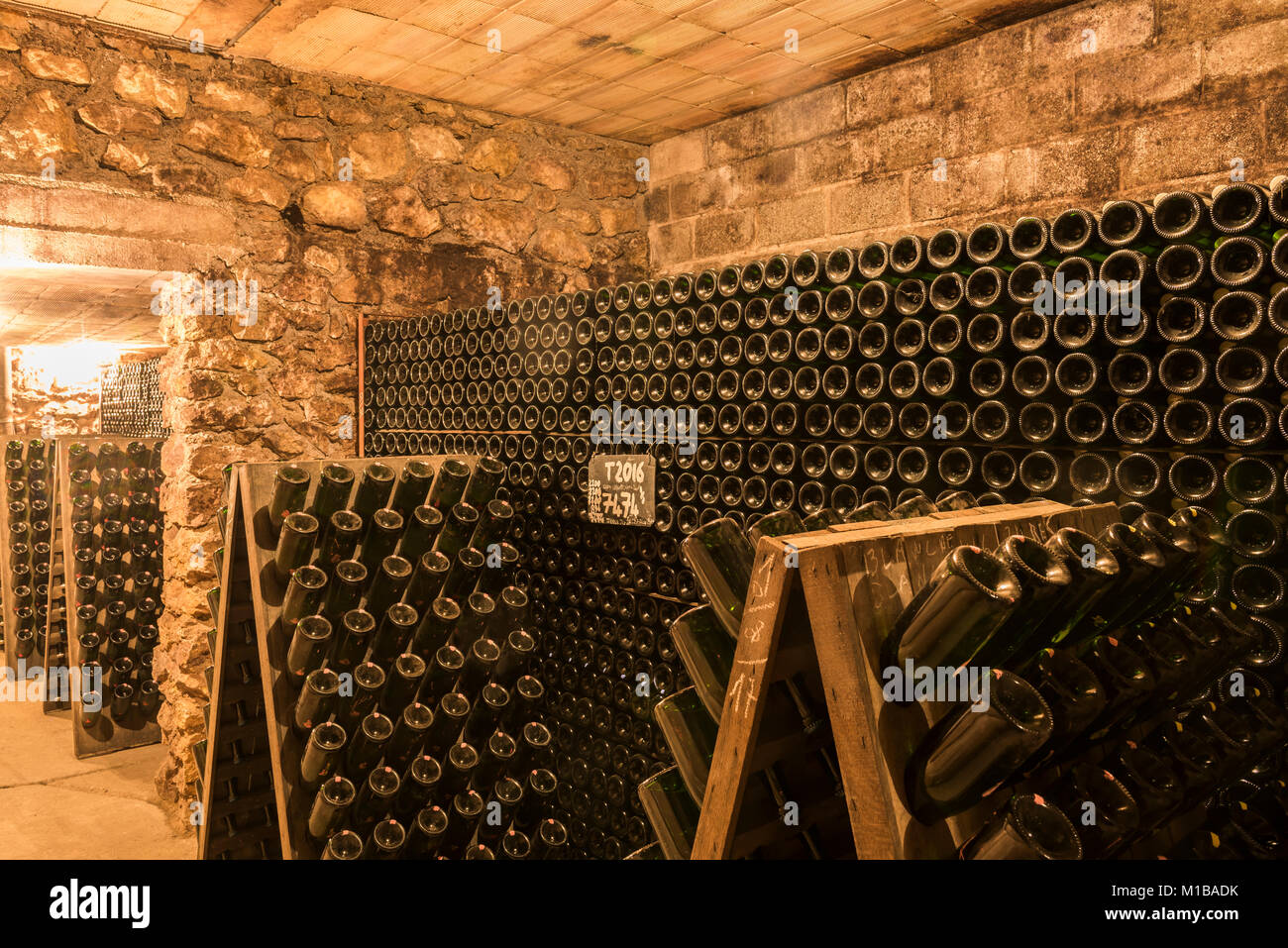 Hautvillers, France - August 11, 2017: Champagne caves and cellars with champagne bottles in pupitres in Hautvillers near Reims and Epernay. Stock Photo