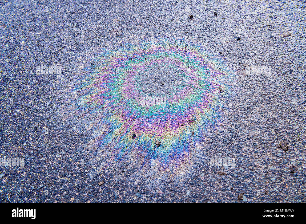 petrol stain on asphalt Stock Photo Alamy