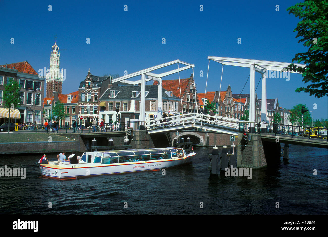 The Netherlands. Haarlem. Drawbridge across the river called Spaarne. Canal or tour boat. Stock Photo