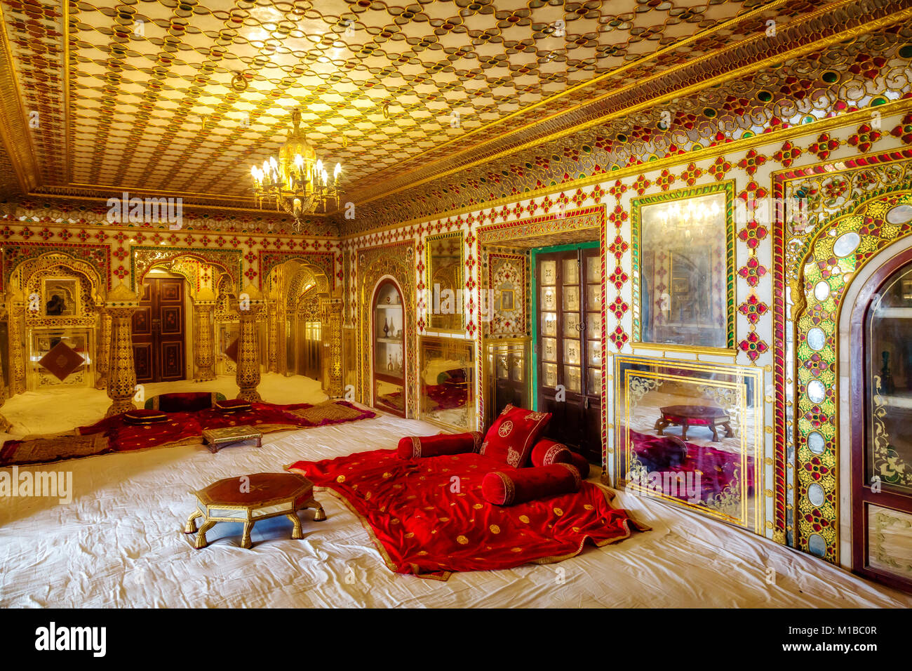 City Palace Jaipur Rajasthan Royal Palace room architecture interior with intricate gold glass
