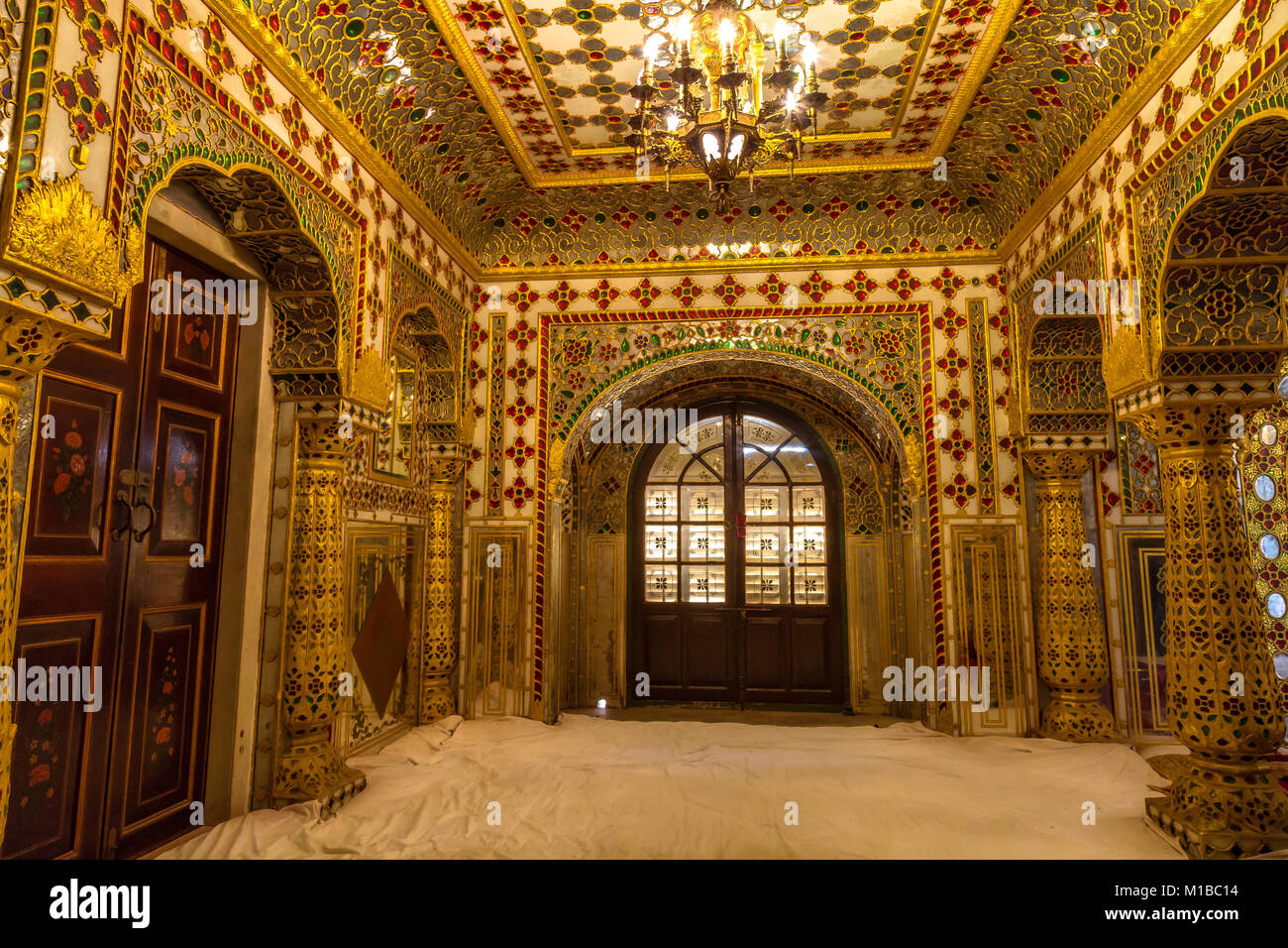 City Palace Jaipur Rajasthan Royal Palace room architecture interior with intricate gold glass