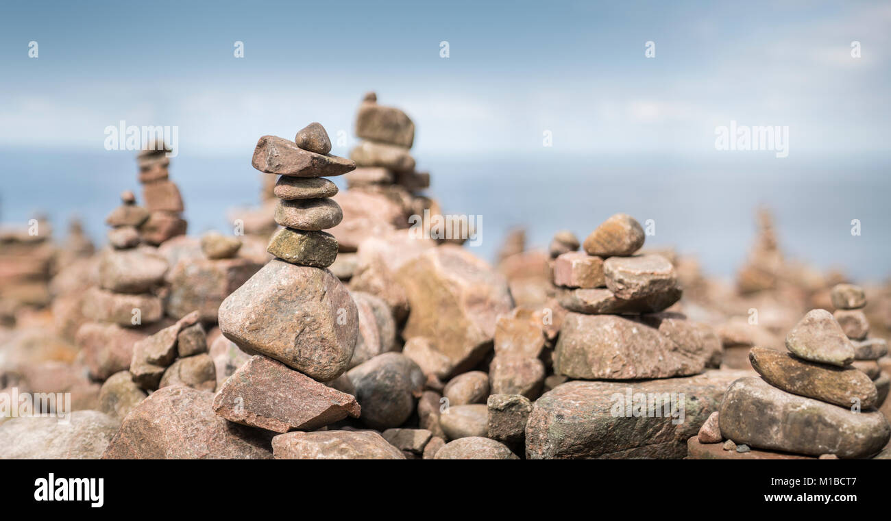 Piles of rocks at beach at Hovs Hallar nature reserve, Torekov, Skane, Sweden, Scandinavia. Stock Photo