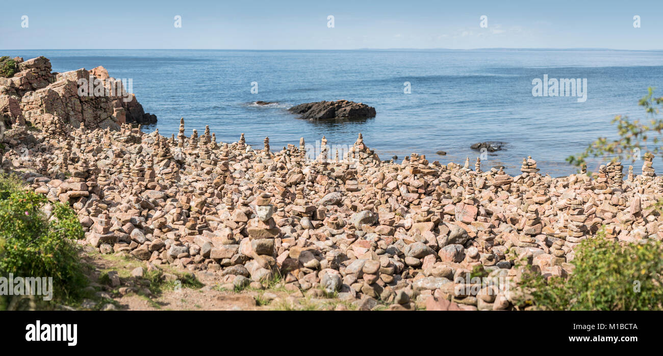 Piles of rocks at beach at Hovs Hallar nature reserve, Torekov, Skane, Sweden, Scandinavia. Stock Photo