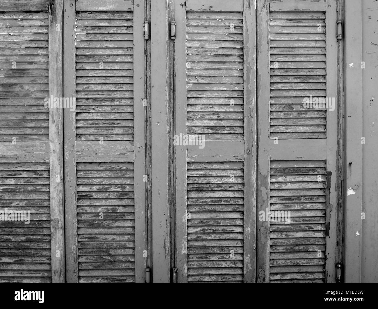 Black & White image of peeling paint of changing room doors at Almyros Beach,Corfu, Greece Stock Photo