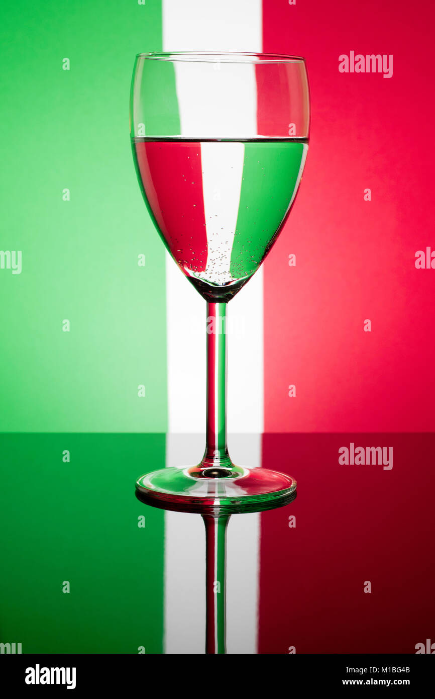 Wine Glass Refracting A Green White And Red Background Stock Photo Alamy