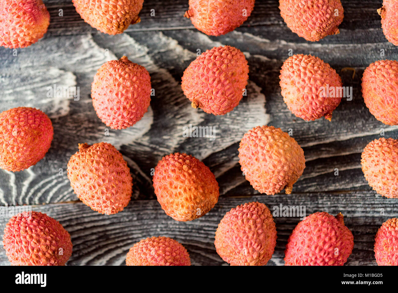 Top view lychee fruit on wooden background Stock Photo