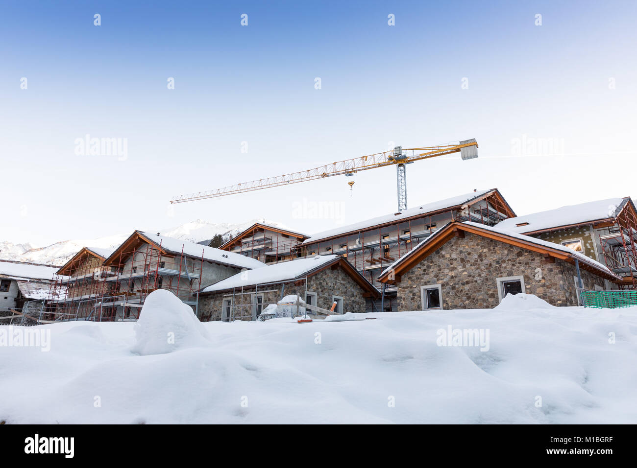 tourist apartment construction at ski resort in Italy Alps Stock Photo