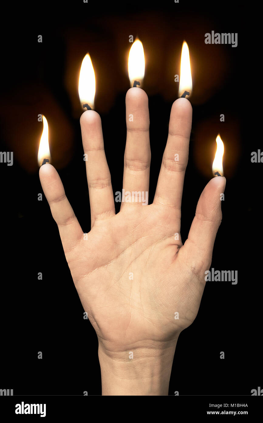 Flams on fingers like five candles Stock Photo
