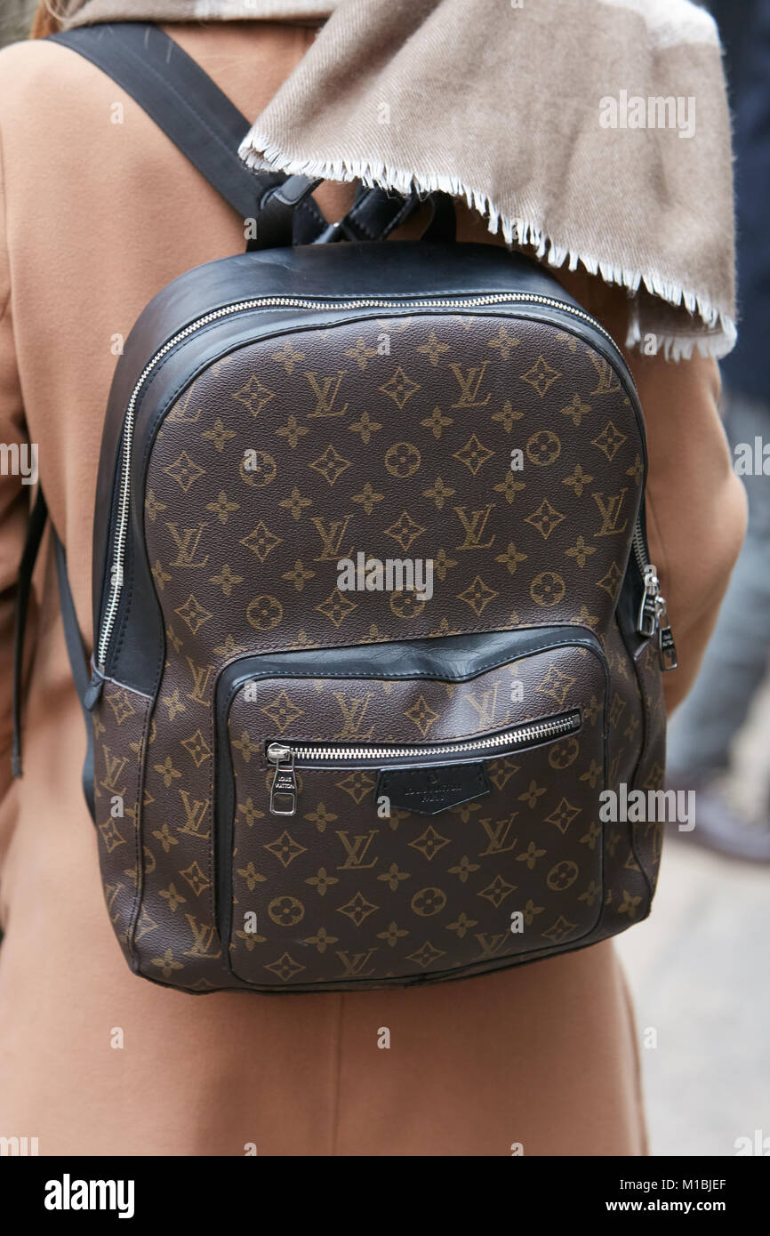 MILAN - SEPTEMBER 23: Man with Louis Vuitton backpack and shirt with flames  before Antonio Marras fashion show, Milan Fashion Week street style on Sep  Stock Photo - Alamy