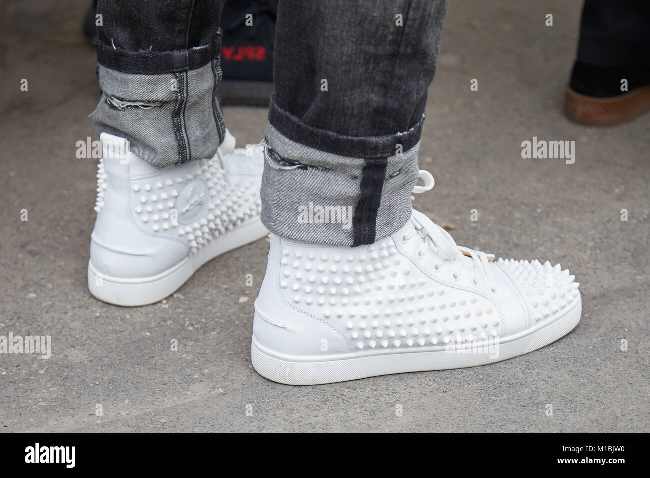 MILAN - JANUARY 15: Man with Louboutin white sneakers shoes with Stock Photo - Alamy